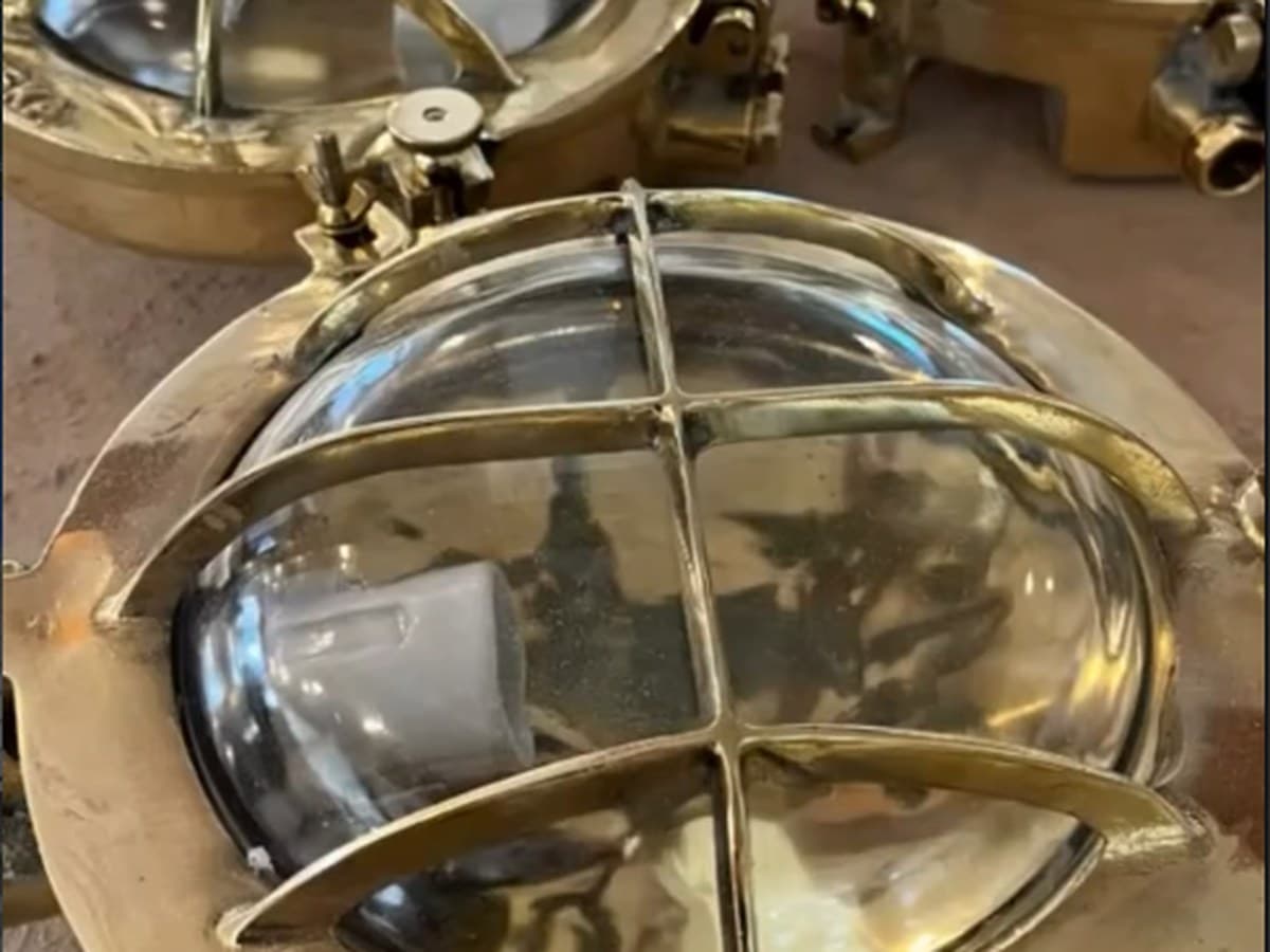 A solid brass marine cage light