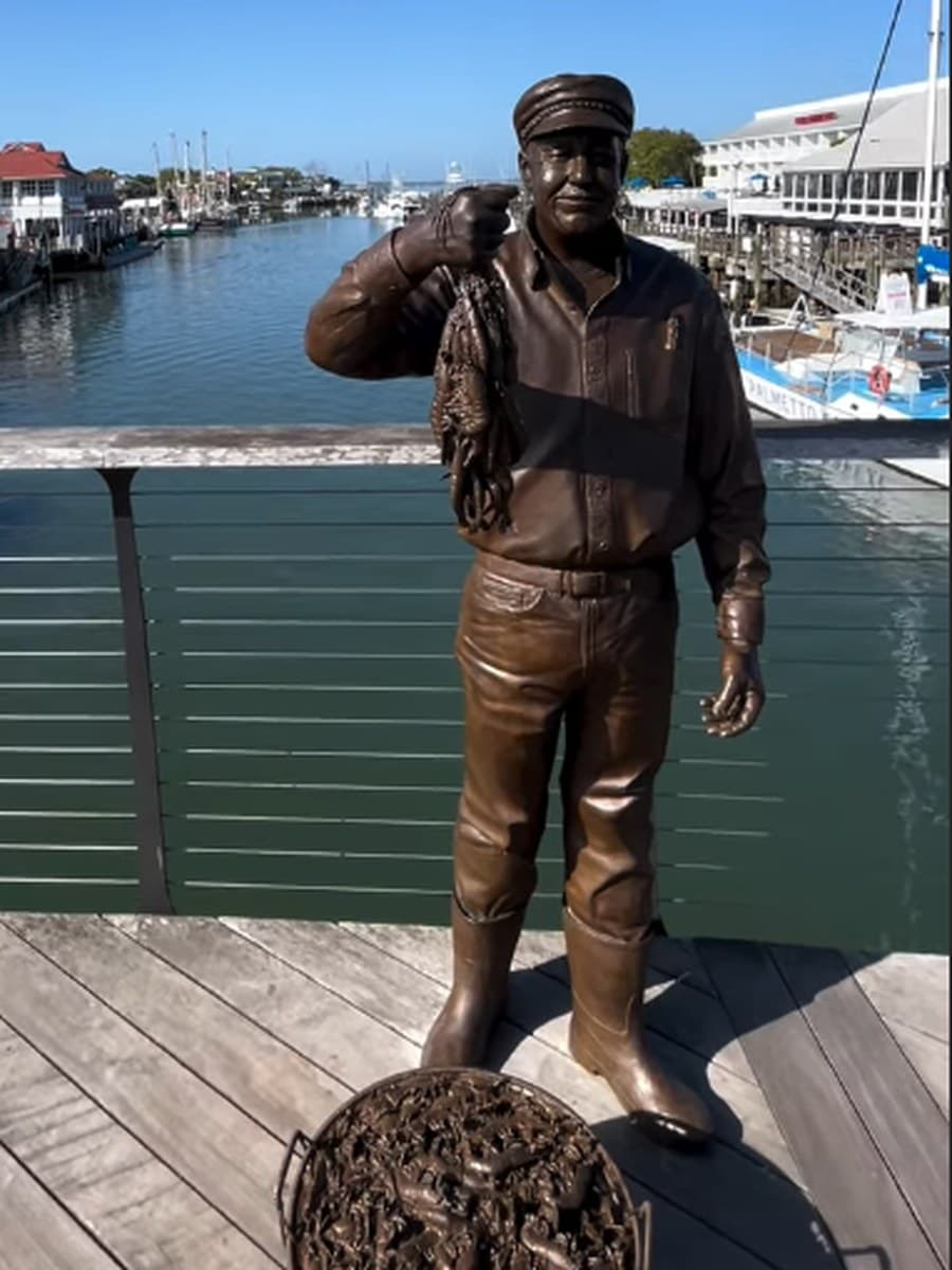 The bronze memorial to Captain Wayne Magwood on the Shem Creek boardwalk